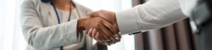 handshake of people at business conference